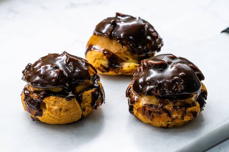 French Dessert Chocolate Eclair with Cream Filled Close Up Macro View.の写真素材