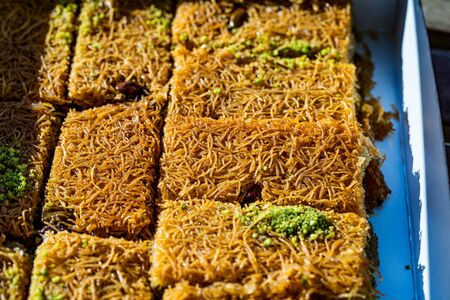 Take Away Turkish Dessert Kadayif with Pistachio Powder in Plastic Boxの写真素材