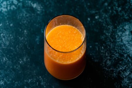 Healthy Organic Homemade Orange Carrot Citrus Mixed Fruit Juice in Glass. Ready to Drinkの写真素材