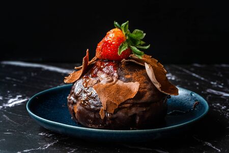 Turkish Dessert Polka Chocolate cake with Strawberry and White Cream from Local Patisserie in Plate for One Person Portion. Traditional Dessert.の写真素材