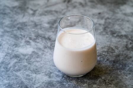 Kefir. Healthy Organic Drinkable Yogurt with Strawberries Fruit in Glass / Buttermilk Ayran. Readyt to Drink.の写真素材