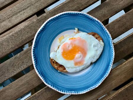 Fried Egg on Toast Bread  Hot Japanese Sandwich in Plate. Ready to Eat Healthy Fast Food.の写真素材