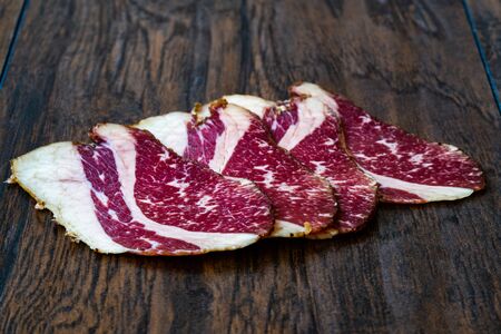 Raw Smoked Dry Aged Veal Rib Slices.  Slim Sliced and Cut Ham / Salami. Ready to Eat.の写真素材