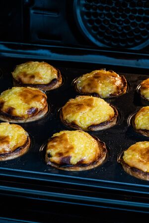 Pasteis de Nata or Belem Tart. Portuguese Custard made with Egg, Cinnamon, Sugar and Flour in Muffin...