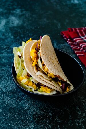 Turkish Mexican Style Taco Cig Kofte with Kidney Beans, Red Onions, Grated Cheddar Cheese and Pomegranate Syrup Sauce. Traditional Fast Food.の写真素材