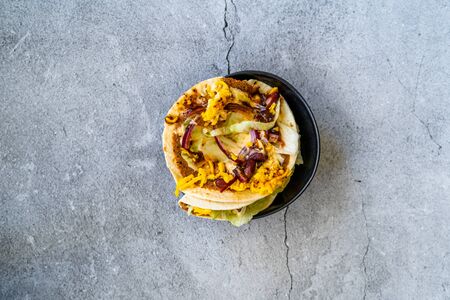 Turkish Mexican Style Taco Cig Kofte with Kidney Beans, Red Onions, Grated Cheddar Cheese and...