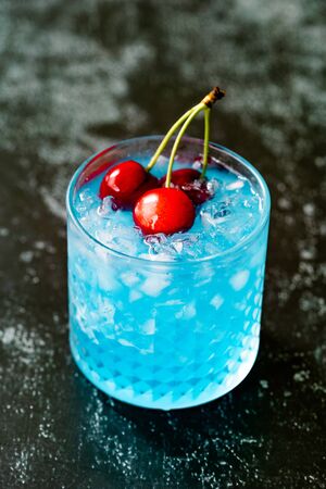 Blue Lagoon Cocktail with Cherries and Crushed Ice. Ready to Drink.の写真素材