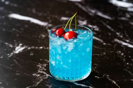 Blue Lagoon Cocktail with Cherries and Crushed Ice. Ready to Drink.の写真素材
