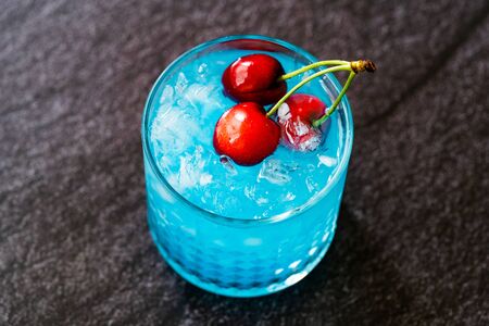 Blue Lagoon Cocktail with Cherries and Crushed Ice. Ready to Drink.の写真素材