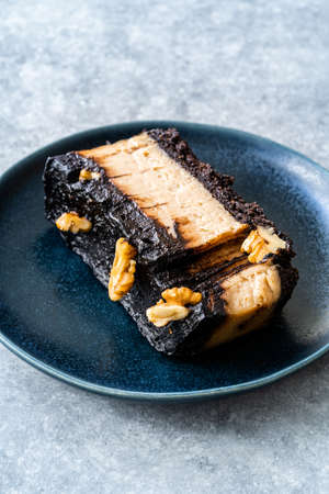 Peanut Butter Pie with Chocolate Mousse, Ganache Chocolate and Walnut Cooked with Coconut Sugar and...