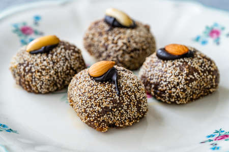 Traditional Turkish Dessert Balbadem / Bal Almond also Called Chocolate Sekerpare with White Poppy...
