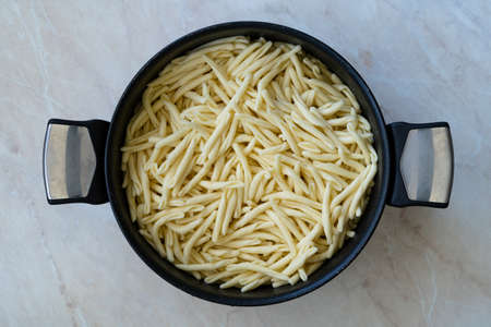 Originial Italian Homemade Trofie Pasta Liguria in Pot. Traditional Food.の写真素材