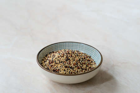 Raw Mixed Tricolor / Three Color Quinoa in Bowl. Ready to Use.の写真素材