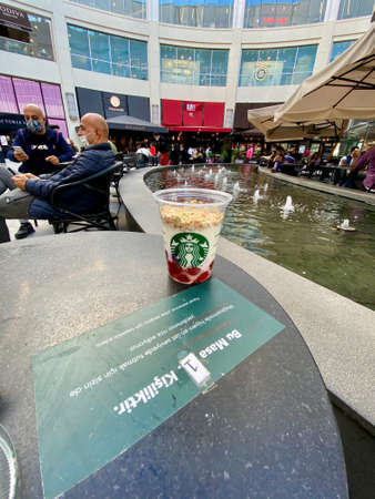 Istanbul - Turkey 14 December 20 2018 Starbucks Food Parfait with Yogurt and Granola Holding with Plastic Spoon and Cup. Take Away. Ready to Eat.のeditorial素材