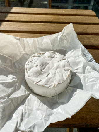 Brie Cheese on Wooden Table. Ready to Serve and Eat or Camembert Cheese. Ready to Serve and Eat.の写真素材