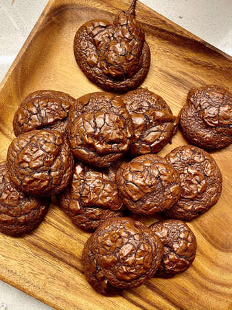 Chocolate Brownie Cookies with Cacao Nibs on Wooden Plate. Ready to Eat.
