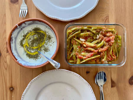 Healhty Homemade Organic Turkish Food Fresh Green Beans and Tzatziki Cacik on Wooden Table. Ready to Eat.の写真素材