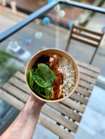 Take Away Teriyaki Salmon and Basmati Rice in Take Out Plastic Bowl. Ready to Eat.
