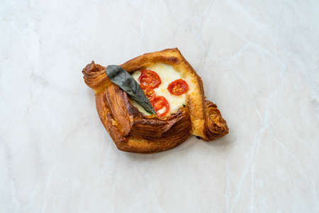 Croissant Sandwich with Mozzarella, Cherry Tomatoes and Bay Leaf. Open Ready to Eat.の写真素材
