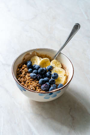 Granola with Blueberries, Banana and Peanut Butter Yogurt or Yoghurt. Ready to Serve and Eat.の写真素材