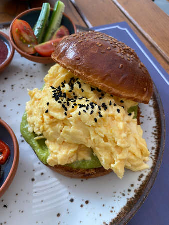 Scrambled Egg with Brioche Bread in Breakfast Plate. Shokupan Bread and Black Cumin Seeds. Ready to Serve and Eat.の写真素材