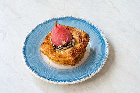Round Fruity Croissant with Candied Pear, Bitter Chocolate and Hazelnut. Ready to Eat.