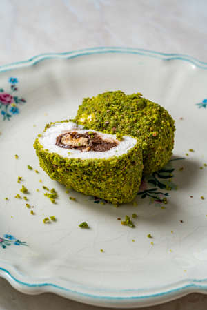 Turkish specific dessert muska pestil with pistachio powder and hazelnut chocolate cream . amulet....