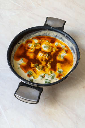 Roasted Green Pepper with Milk in Pan. Traditional Turkish Food. Roasted Peppers with Water....