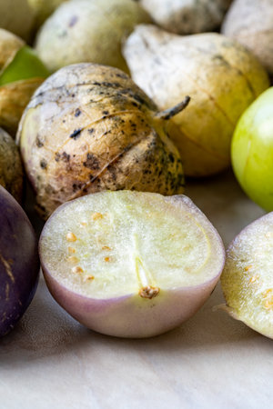 Tomatillos, green tomatoes, with salsa verde, green sauce, in a molcajete, traditional Mexican mortar. organic food.の写真素材