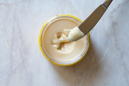 Cream Honey or white honey in jar. ready to eat. organic food