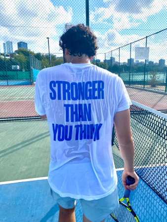 Sweaty Male Tennis Player Holding Racket at Tennis Court. Ready to Play.の写真素材