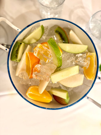 Fruit salad with ice box at fish restaurant on dinner tableの写真素材