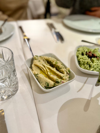 Traditional fava with olive oil. Mashed broad beans fava appetizer on dinner tableの写真素材