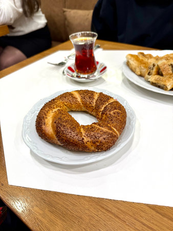 Turkish bagel simit with traditional tea served at local restaurant