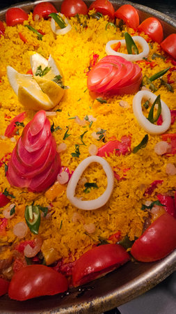 Saffron rice with shrimp and tomatoes served at hotel restaurant. Ready to serveの写真素材