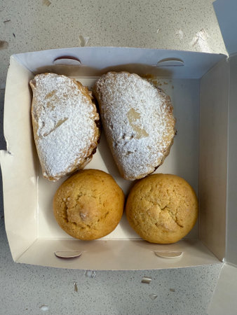 Homemade cookies with powdered sugar in box for sale