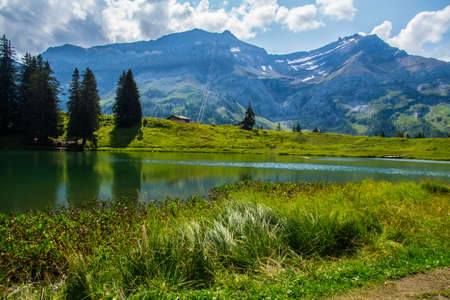 les diablerets in lake of retaud in valais in swissの写真素材