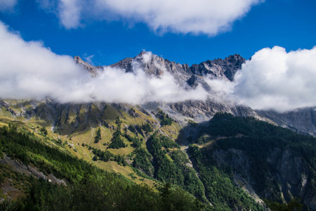 Mountain landscape with clouds in the blue sky. Caucasus, Russiaの写真素材
