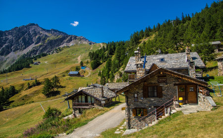 Mountain landscape with alpine houses in the Swiss Alps, Switzerlandの写真素材