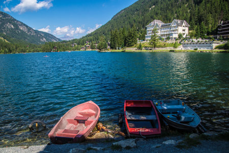 Boat on the shore of the lake in the Austrian Alps.の写真素材