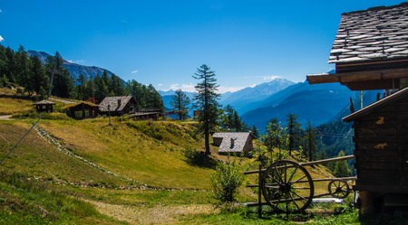 Mountain landscape in the swiss alps with old wooden housesの写真素材