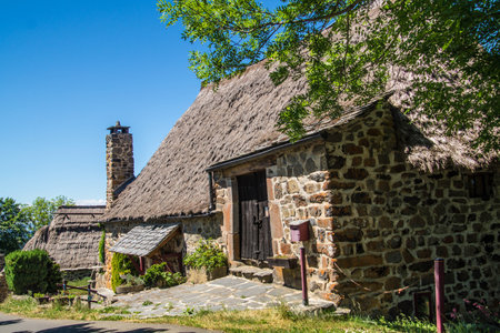 Old traditional wooden house with a chimney in a small village in Scotlandの写真素材