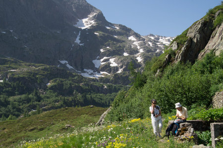 A young couple on a mountain trail in the Pyrenees.の写真素材