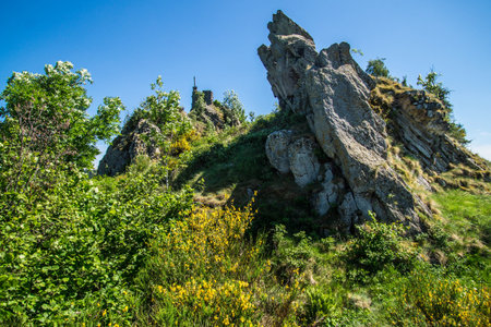 Landscape with ruins of medieval castle on hillside, Carpathians, Ukraineの写真素材