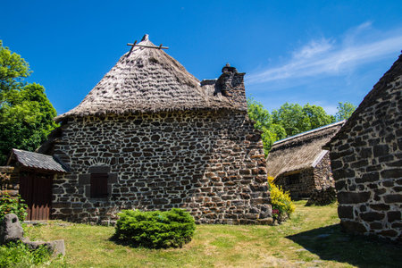 Old medieval stone house with a thatched roof in the village.の写真素材