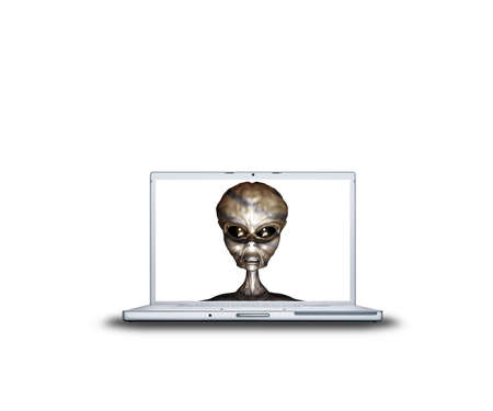 alien head on laptop screen isolated on white backの写真素材