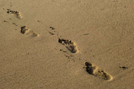 footprints on the Mediterranean Sea beach sand