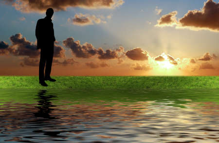 man silhouette on the green grassの写真素材