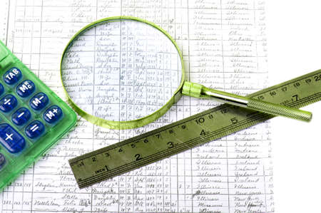 Closeup of sheet with calculator, magnifier and straightedgeの写真素材