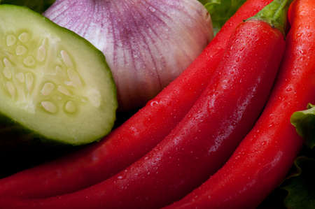 onion and garlic on a wooden cutting boardの写真素材